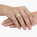 KM Jewelry Co. silver-tone band ring with gold-tone textured inlay, detailed pattern, polished finish.
