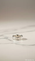 KM Jewelry Co. men's polished stainless steel ring with engraved crosses. Faith-based design.