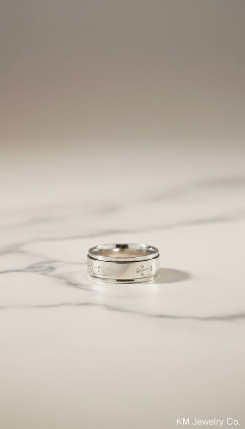KM Jewelry Co. men's polished stainless steel ring with engraved crosses. Faith-based design.