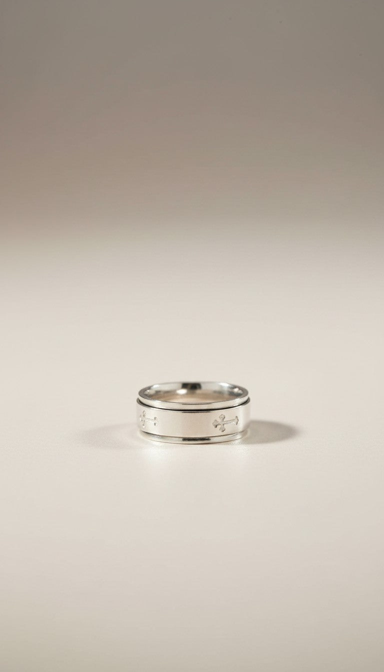 KM Jewelry Co. men's polished stainless steel ring with engraved crosses, a faith-based spinner band.