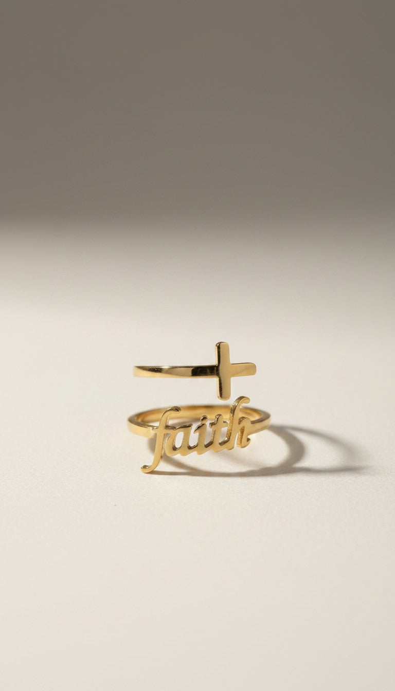 KM Jewelry Co. 18K gold PVD stainless steel ring with a cross and the word "Faith" in script.