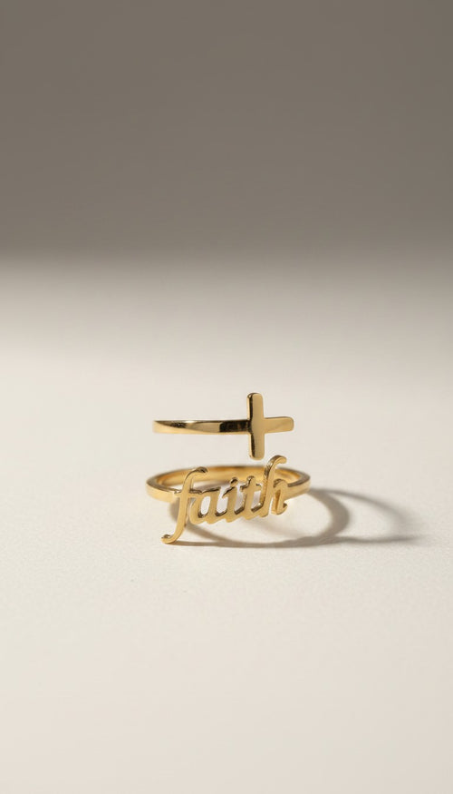 KM Jewelry Co. 18K gold PVD stainless steel ring with a cross and the word "Faith" in script.