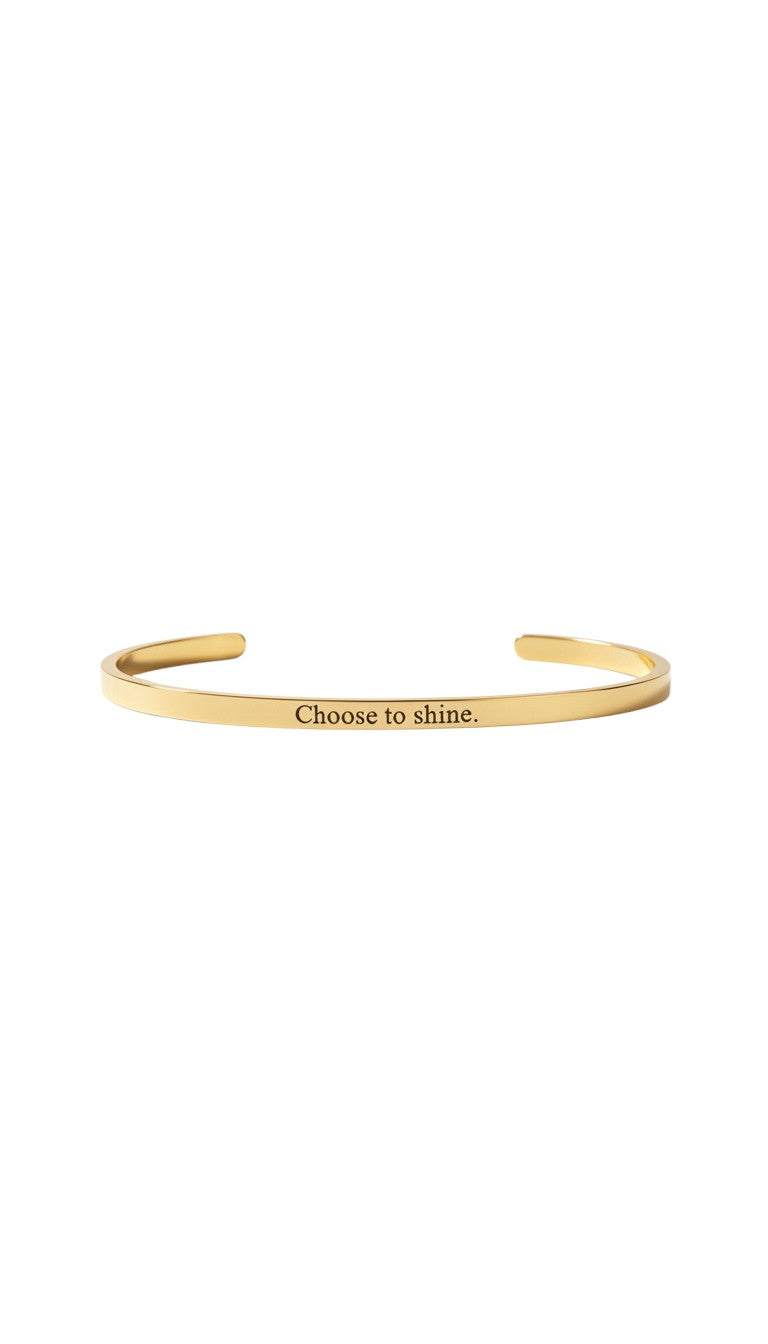 KM Jewelry Co. engraved gold bangle in 18K gold PVD stainless steel with "Choose to shine" inscription.