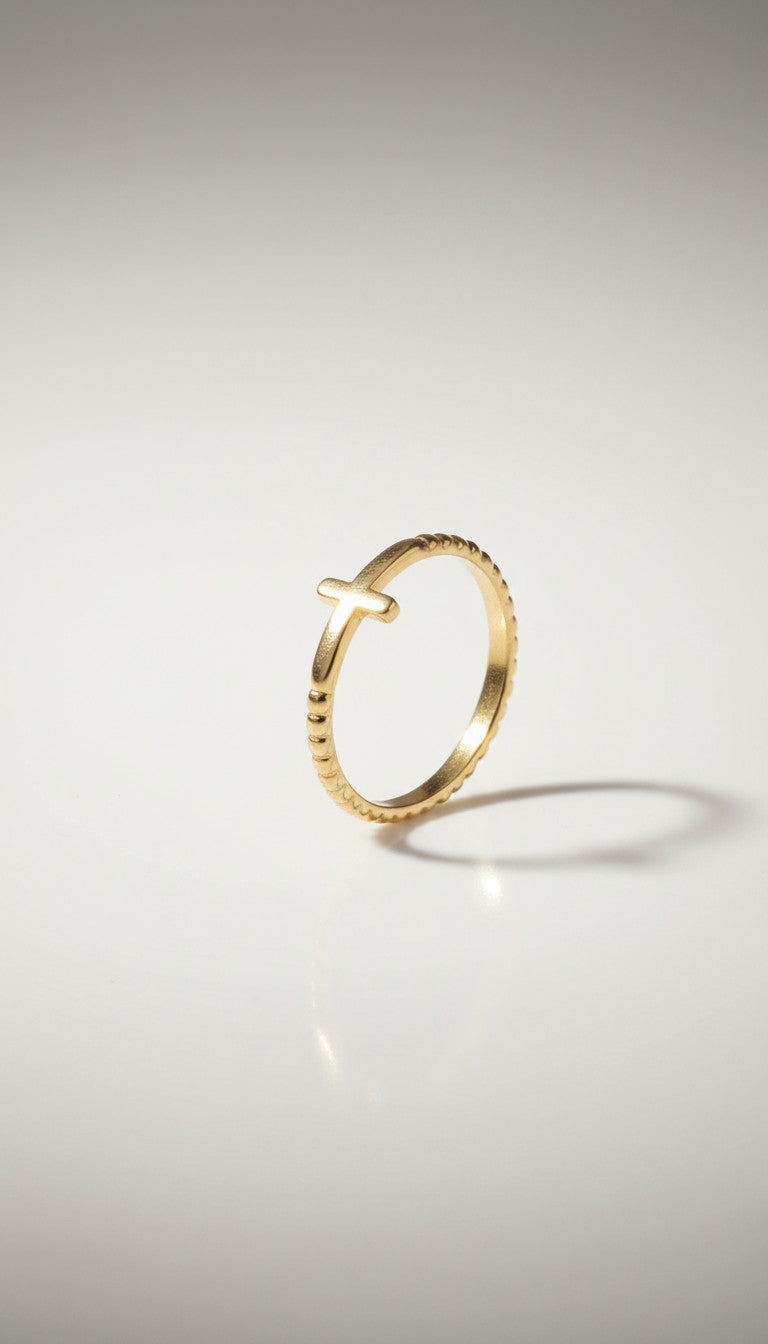 KM Jewelry Co. gold ring with cross detail, 18K gold PVD stainless steel, beaded band.