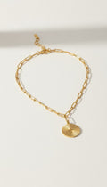 KM Jewelry Co. gold sunburst cross pendant necklace with paperclip chain, 18K gold PVD stainless steel.