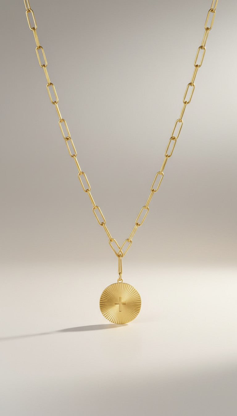 KM Jewelry Co. gold sunburst cross pendant necklace with paperclip chain, 18K gold PVD stainless steel.