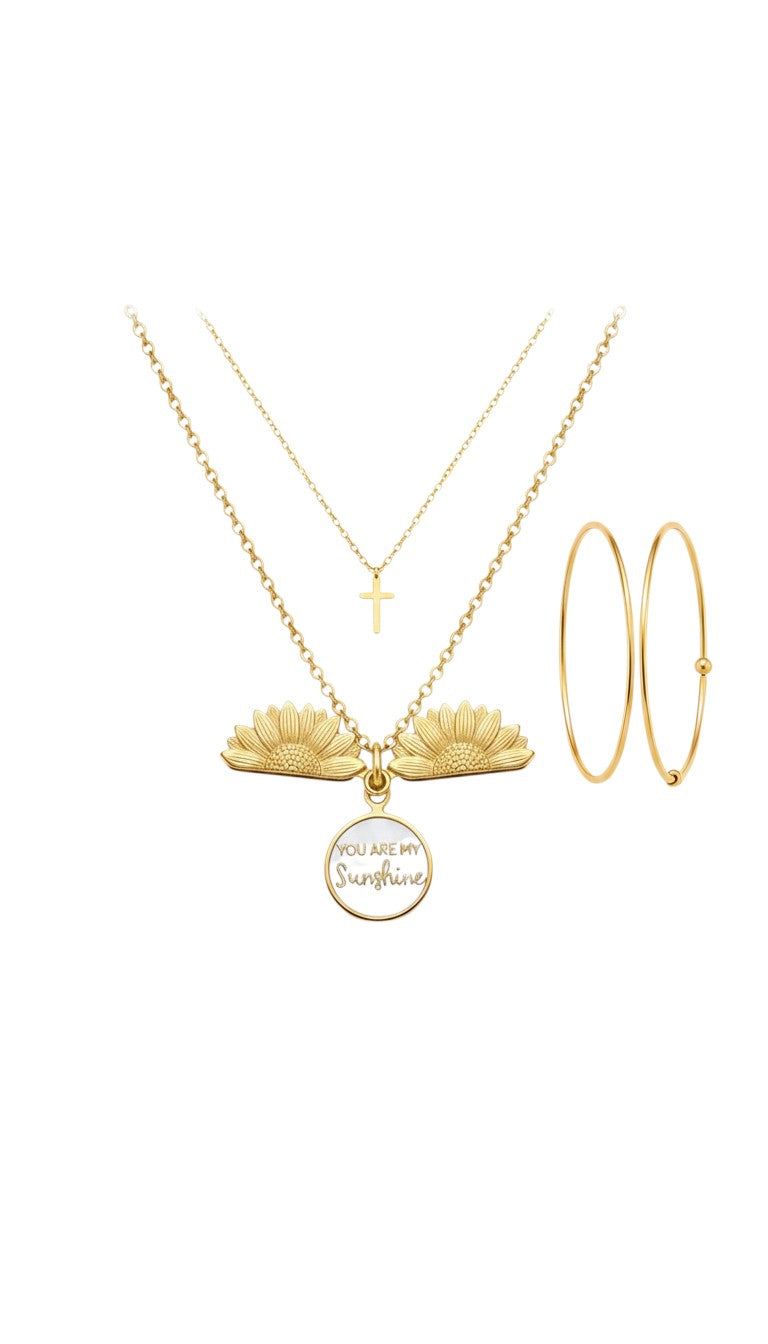 KM Jewelry Co. 18K PVD gold necklace with two sunflower charms and a white pendant reading "You Are My Sunshine".